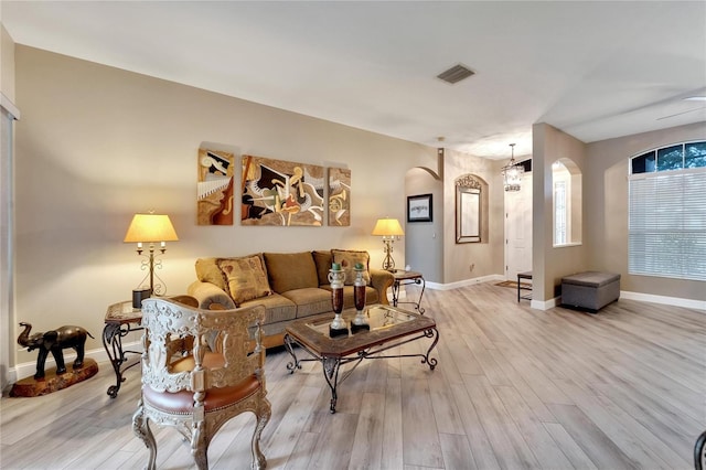 living room with light hardwood / wood-style flooring