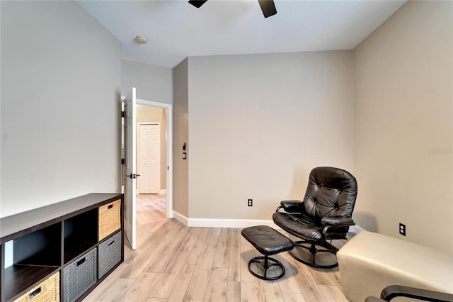 sitting room with light hardwood / wood-style floors and ceiling fan