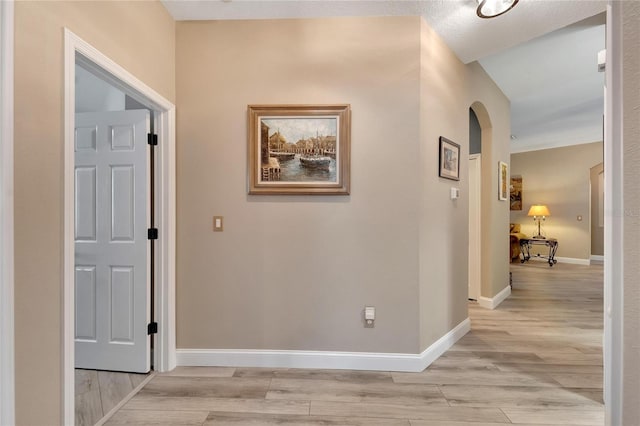 corridor with light wood-type flooring