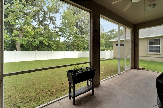 sunroom / solarium with ceiling fan