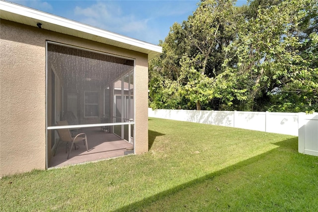 view of yard featuring a sunroom