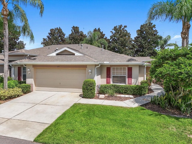 ranch-style home with a front lawn and a garage