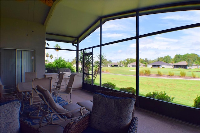 sunroom with lofted ceiling