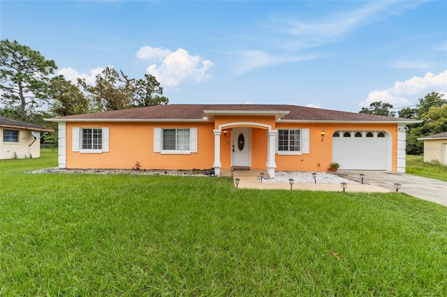 ranch-style house featuring a garage and a front yard