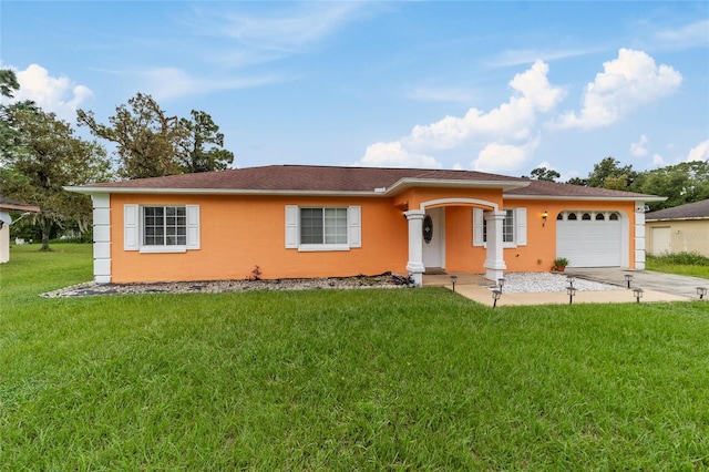 view of front of house featuring a front yard and a garage