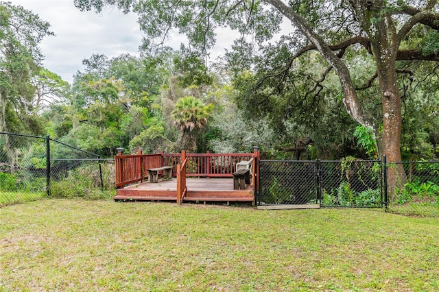 view of yard with a wooden deck