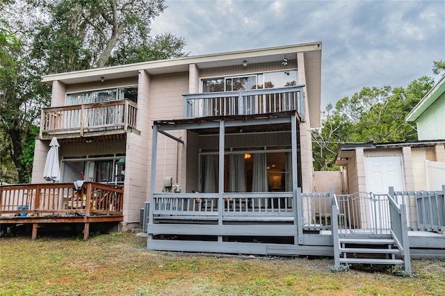 rear view of house featuring a balcony