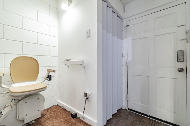 bathroom with toilet and hardwood / wood-style floors