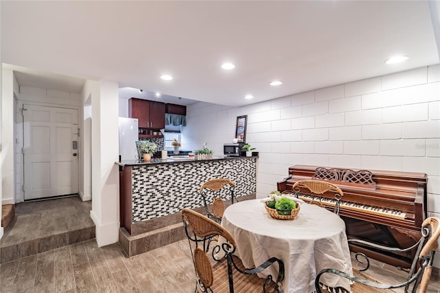 dining area with hardwood / wood-style floors