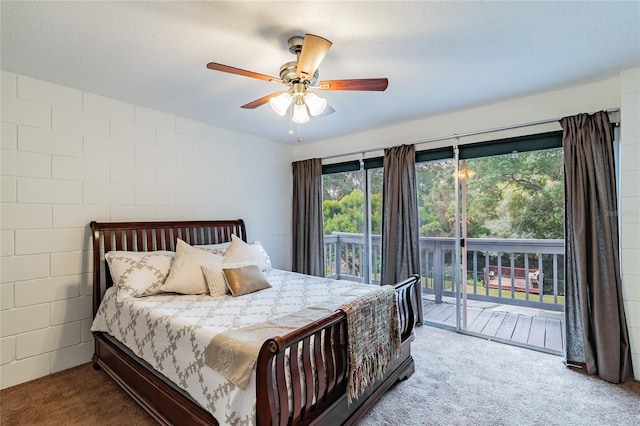 bedroom featuring ceiling fan, access to exterior, a textured ceiling, and carpet flooring