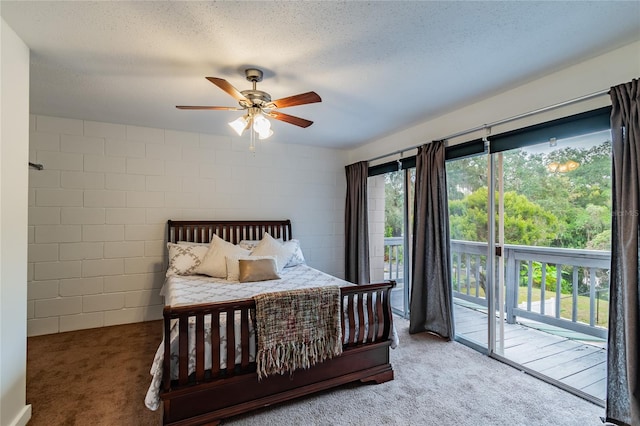 carpeted bedroom featuring ceiling fan, a textured ceiling, and access to outside