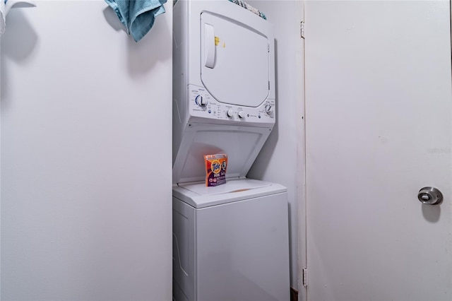 laundry room featuring stacked washer and dryer