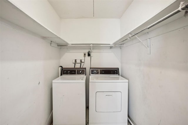 clothes washing area featuring washing machine and clothes dryer