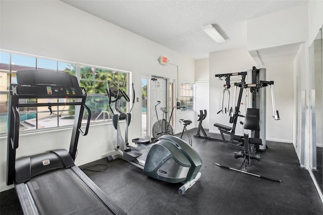 workout area featuring a textured ceiling