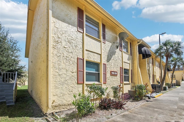 view of building exterior featuring central AC