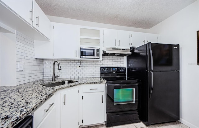 kitchen with sink, backsplash, white cabinetry, black appliances, and light stone countertops