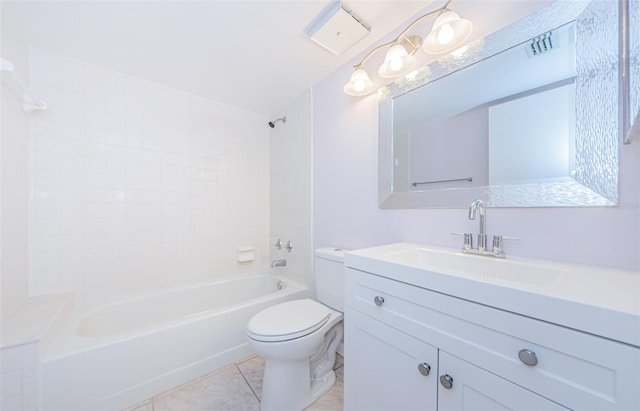 full bathroom featuring tile patterned floors, tiled shower / bath combo, vanity, and toilet