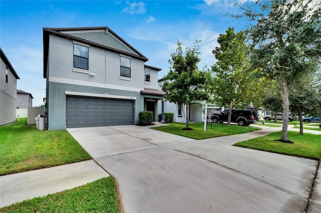 view of front facade with a garage and a front lawn