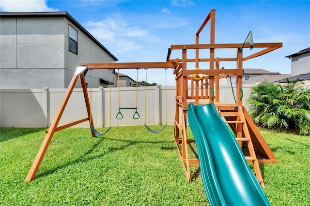 view of playground with a lawn