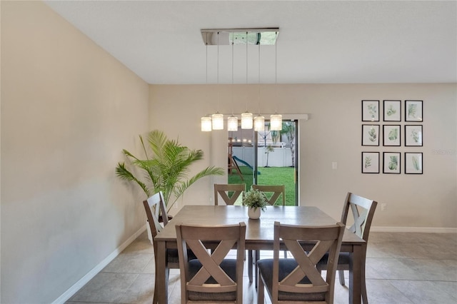 dining space with tile patterned floors