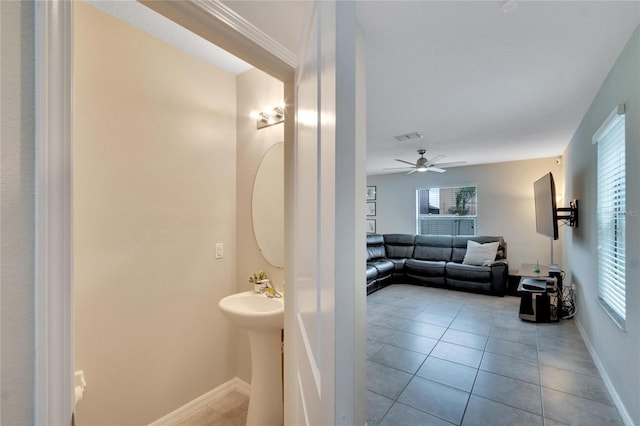 bathroom featuring ceiling fan, tile patterned flooring, and sink