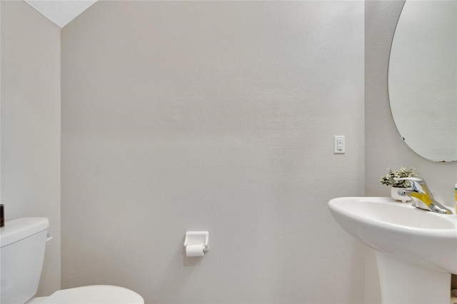 bathroom with sink and toilet