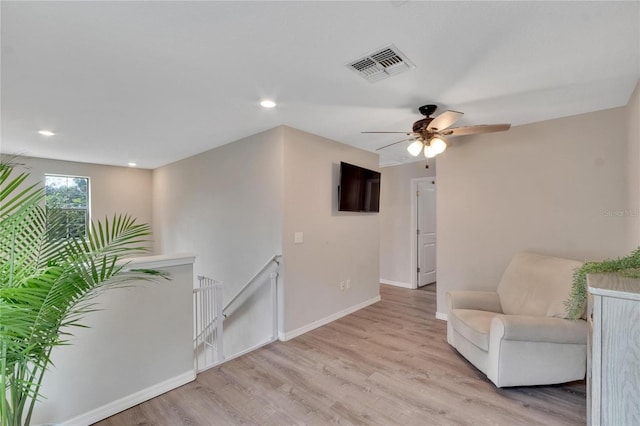 unfurnished room with light hardwood / wood-style flooring and ceiling fan