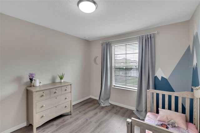 bedroom with light hardwood / wood-style floors