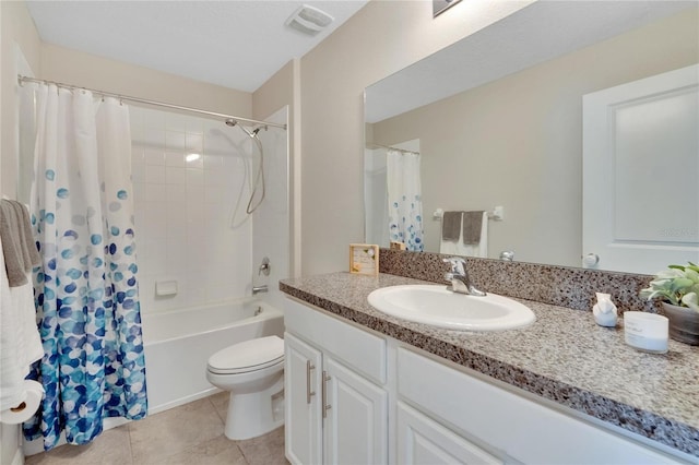 full bathroom with tile patterned floors, vanity, toilet, and shower / tub combo