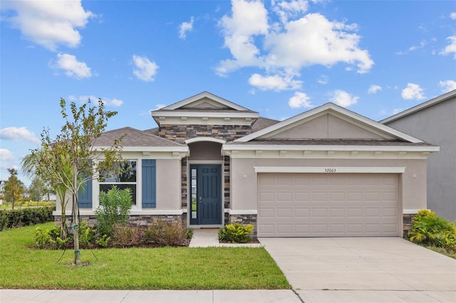 view of front facade with a front yard and a garage