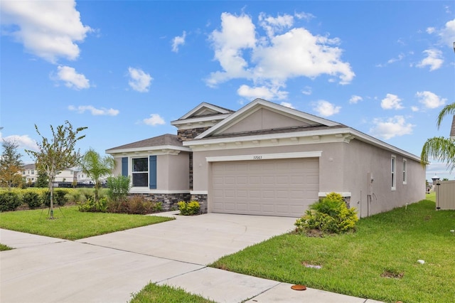 view of front facade with a garage and a front lawn