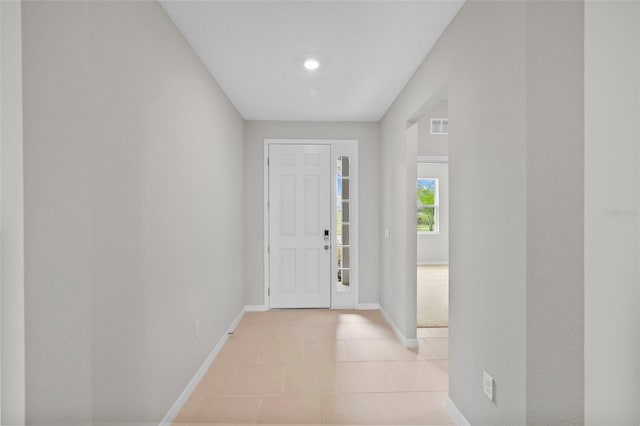 entryway with light tile patterned floors