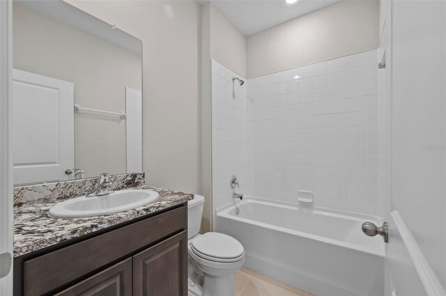 full bathroom with shower / washtub combination, vanity, toilet, and tile patterned floors