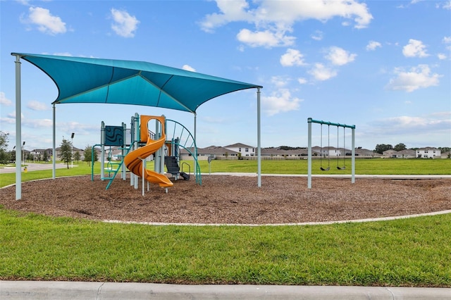 view of jungle gym with a lawn