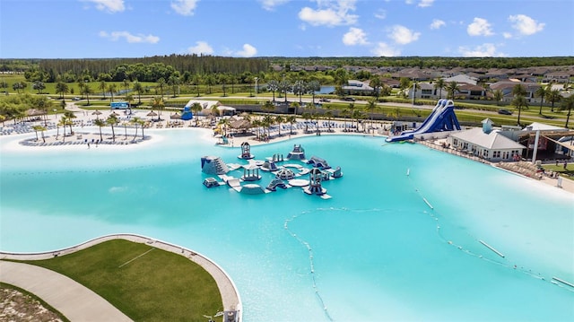 view of swimming pool with a water slide