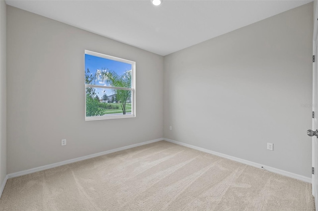 empty room featuring light carpet