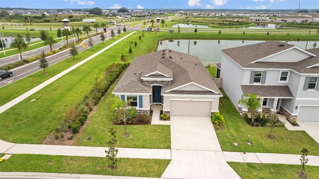 birds eye view of property featuring a water view