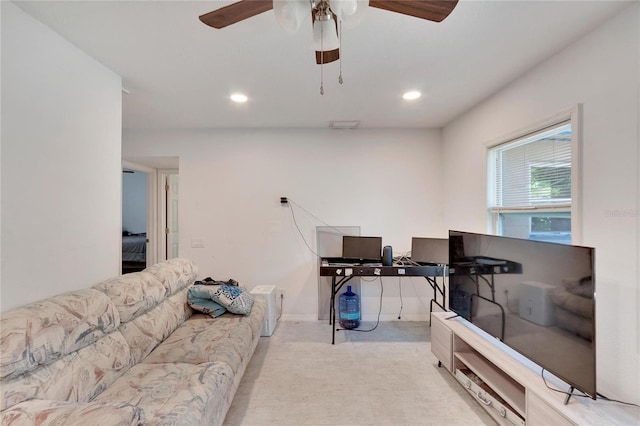 living room with light carpet and ceiling fan