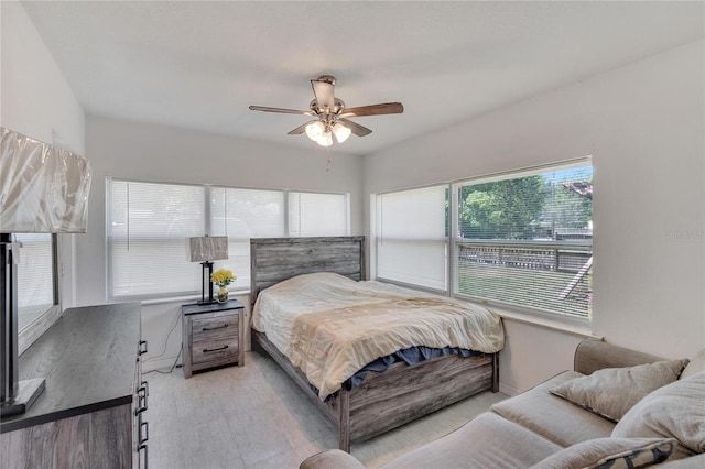 bedroom featuring baseboards and a ceiling fan