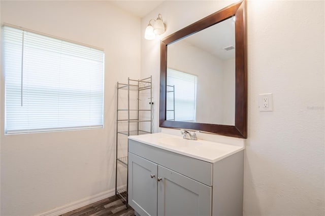 bathroom featuring hardwood / wood-style floors and vanity