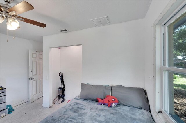 bedroom featuring ceiling fan and visible vents