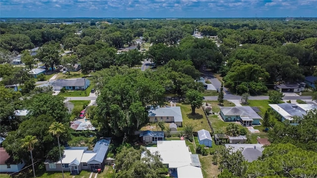 aerial view with a residential view and a view of trees