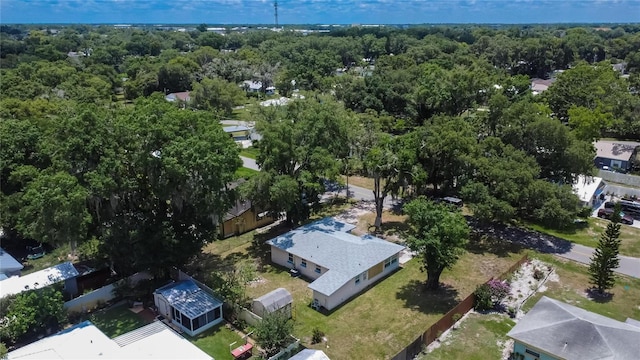 drone / aerial view featuring a view of trees