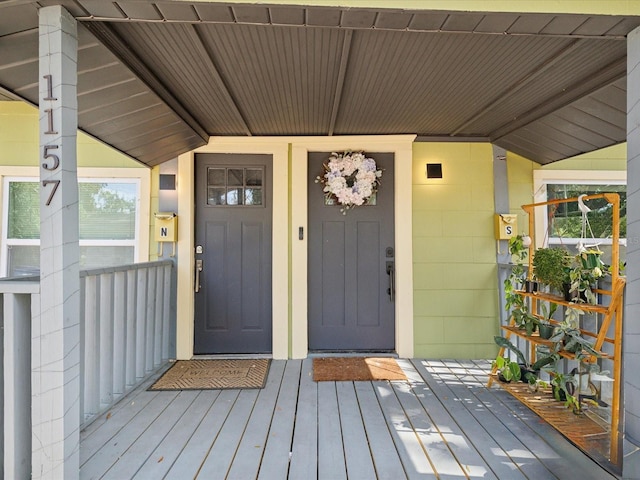 property entrance with a wooden deck