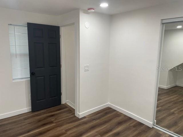 foyer with dark hardwood / wood-style flooring