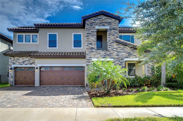 mediterranean / spanish-style house featuring a garage