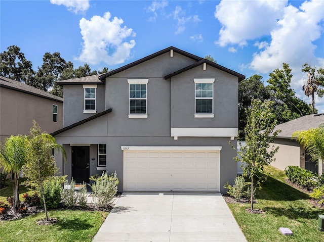 front facade with a garage and a front yard