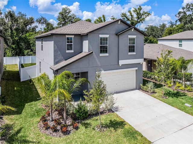 view of front property with a front lawn and a garage