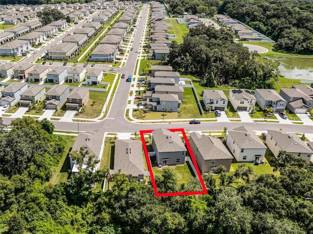 birds eye view of property with a water view