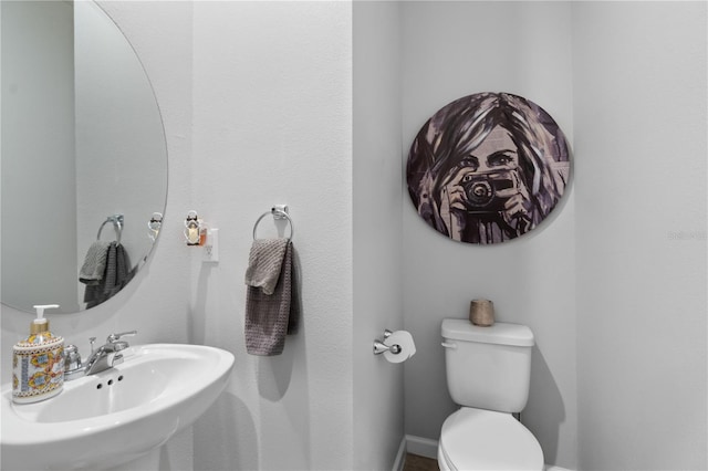 bathroom featuring sink and toilet